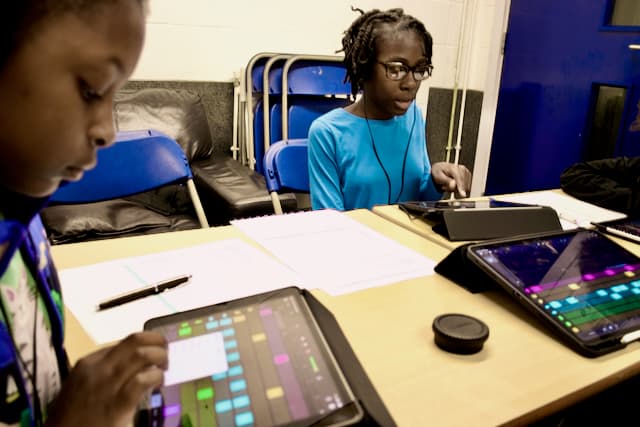 Student focused on music production at the Production Lab, Kynda Learning South London